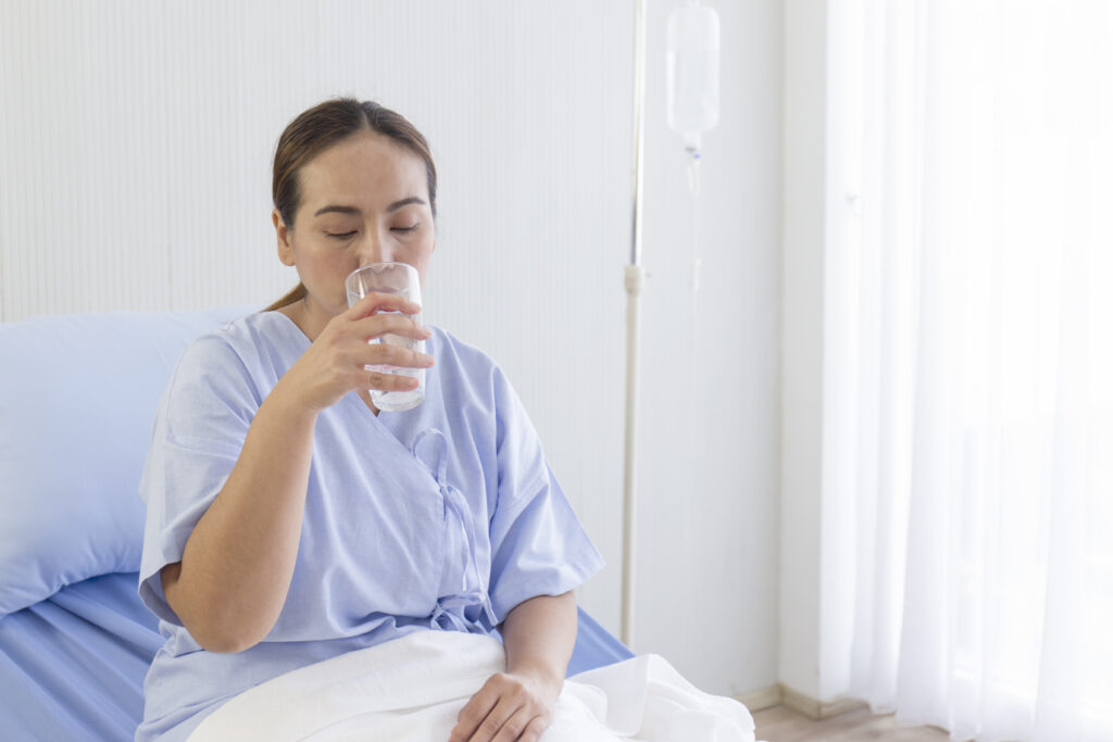 asian female patients drinking water